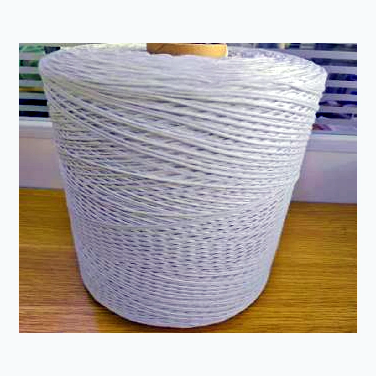 Large spool of cable filling rope