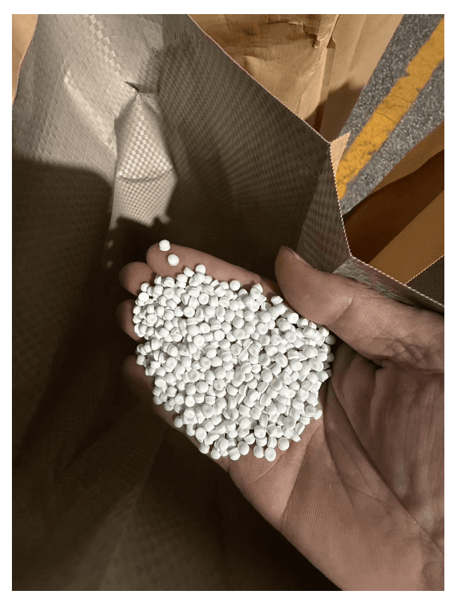 White material pellets in warehouse inventory