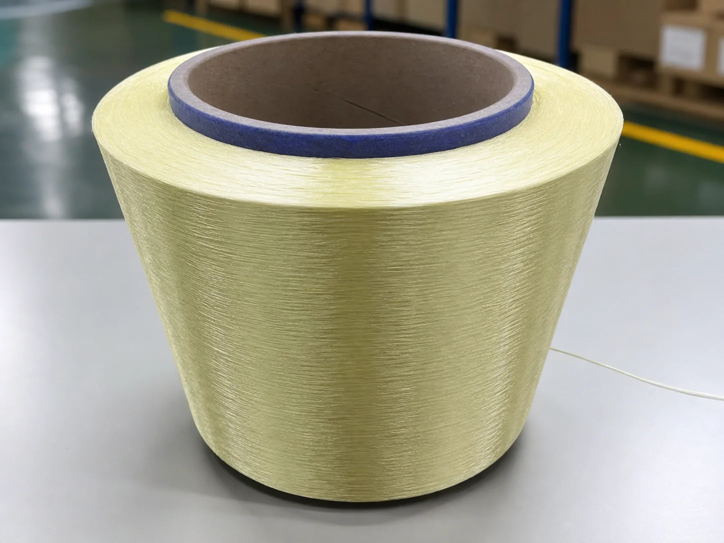 Pale-yellow aramid reinforcement yarn spool